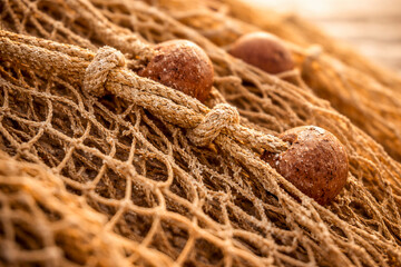 Old fishing net detail at sunset