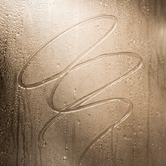 Condensation patterns on foggy glass