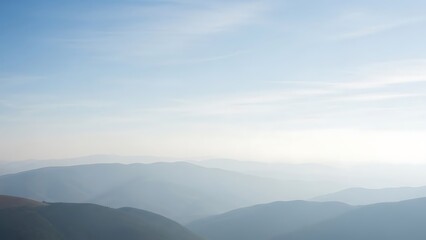 Serene Mountain Range Silhouette Under a Hazy Sky, Evoking Peace and Vastness