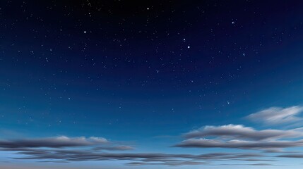 Naklejka premium Night Sky with Stars and Soft Clouds at Dusk, a Serene View of the Universe Above, Ideal for Calm and Peaceful Backgrounds and Designs