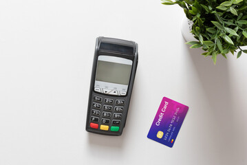 Black pos terminal and credit card top view