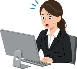Worried Businesswoman Working Late On Computer In Office