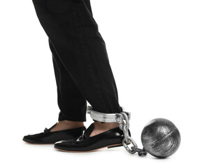 Businessman with metal ball and chain on his leg against white background, closeup
