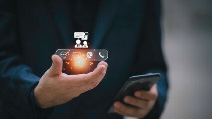 Businessman using Smart Phone with the email, call phone, address, Chat message icons.Customer support hotline Contact us people connection.