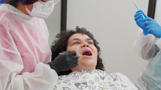 Dentist administering anesthesia injection to patient