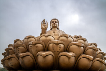 Great Buddha Statue on a lotus flower in the Nanshan scenic area of the Jiaodong Peninsula, Longkou, Shandong, China