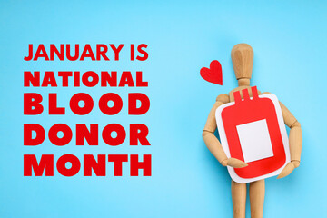 Wooden mannequin with blood bag on blue background