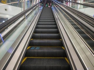Modern Escalator Leading Upwards in a Bright Indoor Space