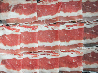 Fresh Raw Bacon Strips with Marbled Fat Ready for Cooking