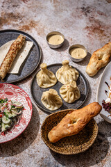Fototapeta premium Georgian khinkali lunch set with kebab and salad