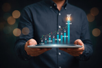Businessman holding digital tablet with rising financial growth chart and shopping icons representing e commerce performance business analytics online sales and investment growth concept
