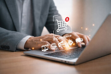 Businessman using laptop with digital e commerce shopping icons, representing online retail transaction customer journey and digital marketplace technology concept