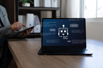 Customer support headset on desk with laptop and online chat interface, help desk communication and AI chatbot service concept for business technology in modern office, copy space.
