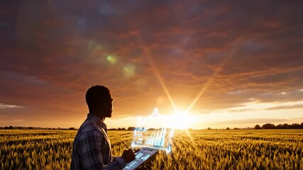 Farmer Analyzing Digital Data in Wheat Field at Sunset - Powered by Adobe