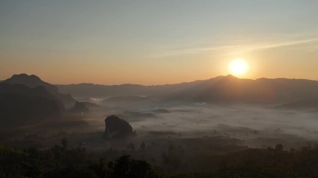 An aerial view of the forest and mountains in a misty morning at Pha Chai Noi, Thailand.