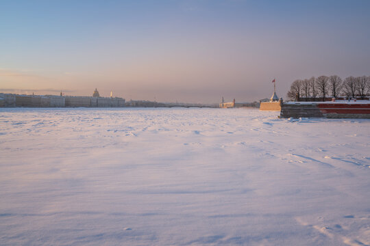 View of the frozen Neva River from the Troitsky Bridge and the city skyline in the background on a freezing winter day, Saint Petersburg, Russia