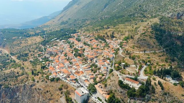 Delphi, Greece. Modern tourist city. Sunny weather, Summer. Drone footage, Point of interest