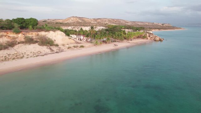 Aerial flyover of Playa La Paria beach on Araya Peninsula Venezuela