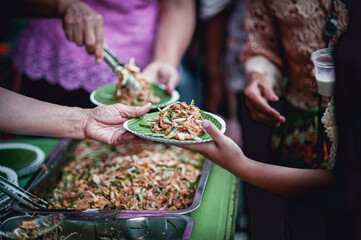 The hands of the hungry are asking for food from the donor,Out to the Homeless and Hungry