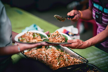volunteers give food to local poor people, Feeding the poor Help them relieve hunger