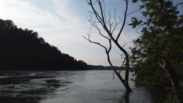 The Niagara River in Lewiston, New York. From riverside in the Niagara Gorge during late afternoon.