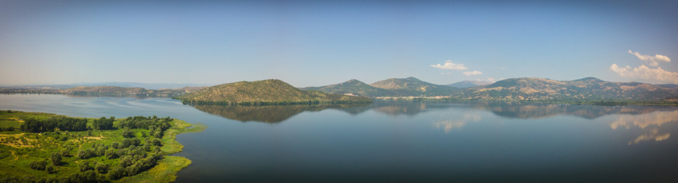 Kastoria lake viewed from the sky. Aerial panoramic view of the land of water located in Macedonia Greece.