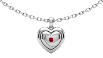 This png features a silver heart-shaped pendant necklace with a layered design: an outer polished heart encasing an inner heart that cradles a faceted red gemstone, likely a ruby. Suspended from a sil
