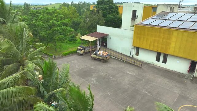 Professional aerial drone view of a textile manufacturing industry complex in Chandrapur India showcasing wide factory grounds industrial development and production strength.