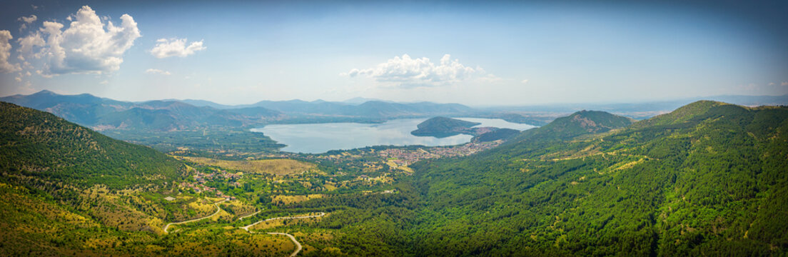 Aerial wide panoramic view of lake Kastoria in Macedonia. The greek land of water is surrounded by mountains 