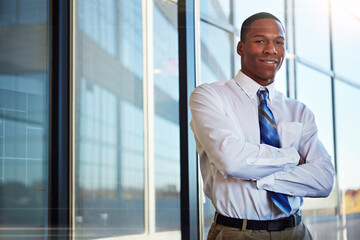 Fototapeta premium Business, man and happy with arms crossed in office for legal career, litigation and about us. Black person, lawyer and portrait at law firm for professional service, corporate justice and confidence