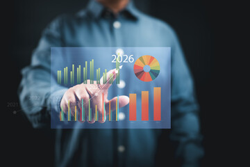 Businessman interacting with futuristic financial charts and graphs showing growth projections for...