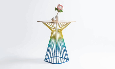 Fototapeta premium Colorful ombre side table with floral decoration