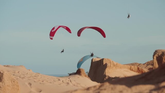 Aerial paragliding adventure above Aracati coastal beach Brazil blue sky