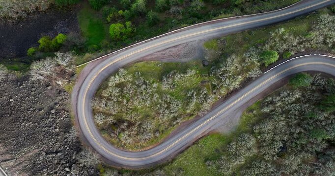 A circling top down aerial DJI drone view of a hairpin corner on a road leading to the Rowena Crest Viewpoint in Mosier Oregon on the Columbia River Gorge National Scenic Area