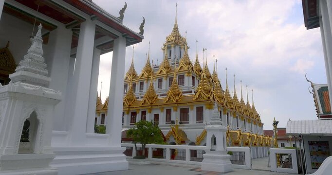 Historic temple of golden decor of Loha Prasat (Metal Castle) at Wat Ratchanatdaram Worawihan in Bangkok, Thailand.