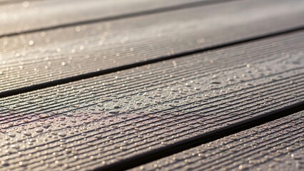 Close Up of Composite Decking Boards with Wood Grain Texture and Morning Dew