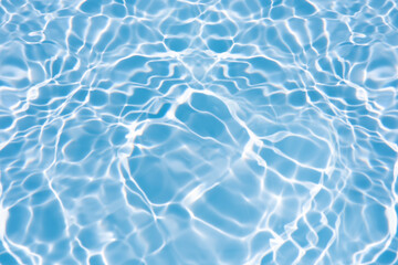 Obraz premium Blue water with ripples on the surface. Defocus blurred transparent blue colored clear calm water surface texture with splashes and bubbles. Water waves with shining pattern texture background.