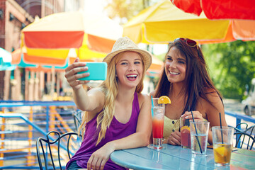 Selfie, smile and women at outdoor restaurant for bonding, memory or social media post on vacation. Happy, cocktails and girl friends with photography picture at cafe for alcoholic drinks on holiday.