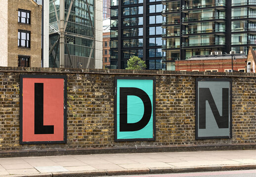 Mockup of real photo of Three Urban Posters on a London Wall