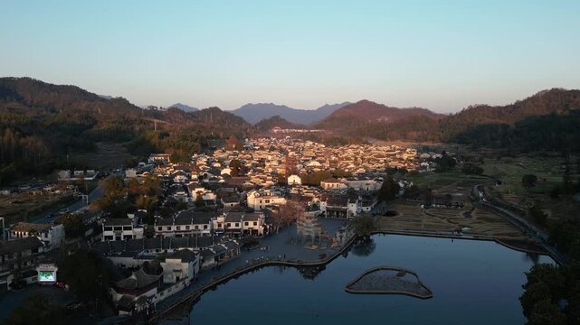 Xidi, China: Dramatic aerial drone footage of the traditional Xidi ancient village at sunset near Huangshan in Anhui province in China. 