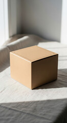 Minimalist Brown Kraft Paper Box Mockup on Natural Linen Fabric with Soft Sunlight and Shadows