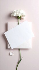 A white card on an envelope with a flower