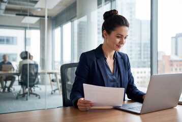 Focused latin business woman accountant working on laptop computer reading financial contract document in office workplace. Mature manager businesswoman specialist doing paperwork using pc. Copy space