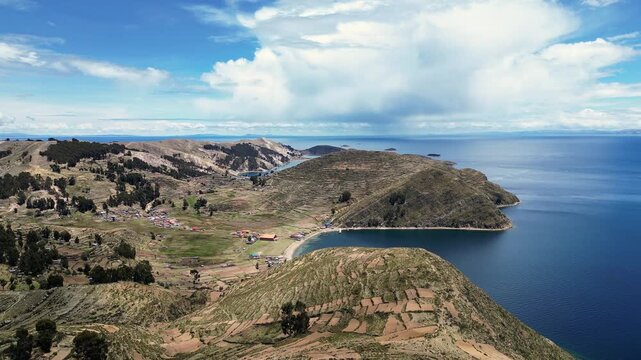 Isla del Sol, Bolivia: Aerial drone footage of the famous isla del sol on the lake titicaca in the Andes in the Bolivia side in south America with forward and tilt down cinematic motion