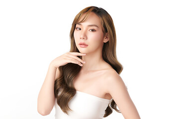A beautiful young Asian woman with clean, fresh skin against a white background. Skincare, facial treatment, cosmetology, beauty, and spa. An elegant portrait of an Asian woman.