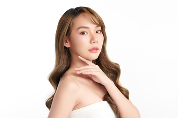 A beautiful young Asian woman with clean, fresh skin against a white background. Skincare, facial treatment, cosmetology, beauty, and spa. An elegant portrait of an Asian woman.