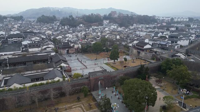 Huangshan, China: Aerial drone footage of the fortified wall and entrance gate of the Huizhou Ancient City in Anhui province in China. 