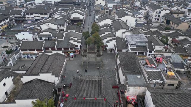 Huangshan, China: Aerial drone footage of the streets of Huizhou Ancient City with the fortified gate and the famous Xuguo Archway in Anhui province in China. 