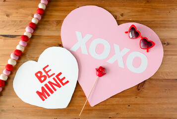 Romantic love decorations with Xoxo and heart-shaped glasses