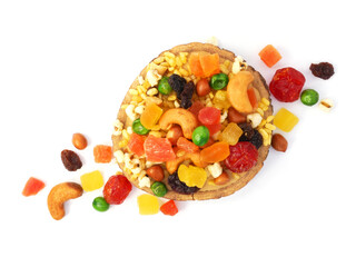 Mix dried fruit and nuts in a wooden tray isolated on white background.